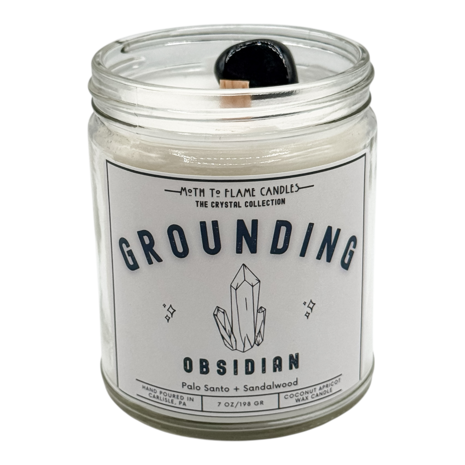 Candle jar labeled 'Grounding Obsidian' with a crystal design on a white background